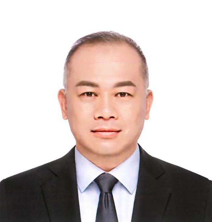 Portrait of David Wong in business attire against white background