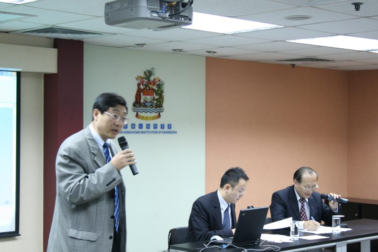 Man speaking into microphone at Hong Kong Institution of Engineers event.