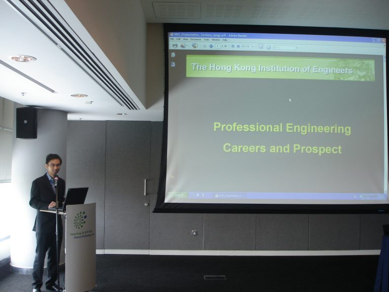 "Man presenting at podium with screen showing ""Professional Engineering Careers and Prospect"