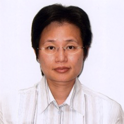 Portrait of Annie CHOI wearing glasses and a striped shirt