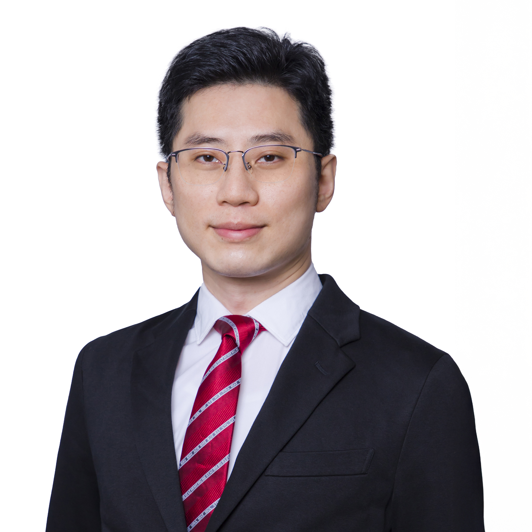Man in glasses wearing suit and red tie
