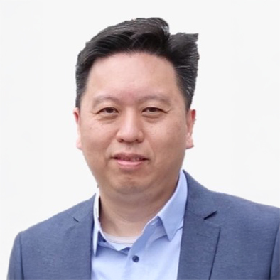 Portrait of Ir Conway NG, smiling, wearing blue blazer and light blue shirt.