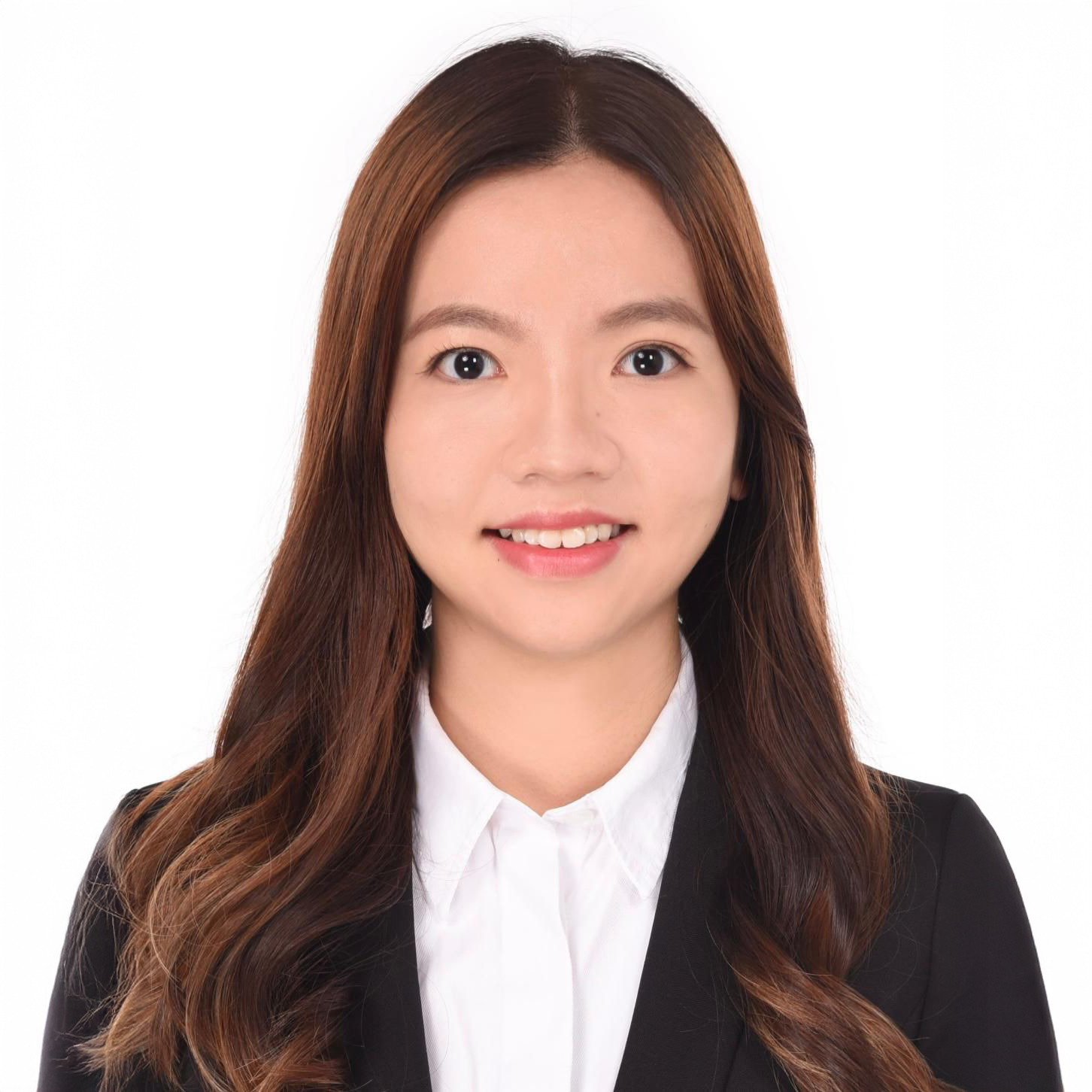 Portrait of Daphne CHAN, smiling, wearing white shirt and black blazer.