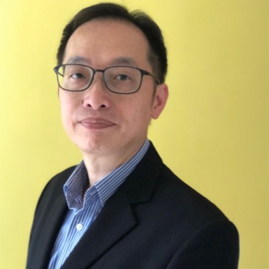 Dr. Charles Cheng, wearing glasses and suit, against yellow background