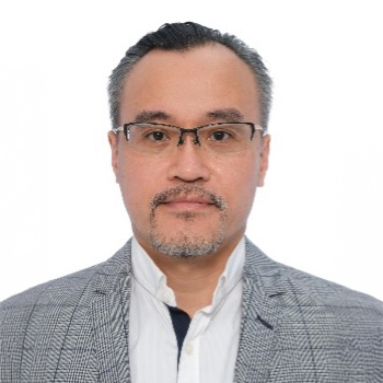 Portrait of Ir Kelvin WONG wearing glasses and a patterned blazer.