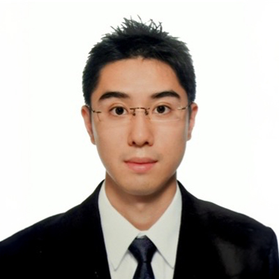 Portrait of Kevin CHOW wearing glasses, suit, and tie against white background.