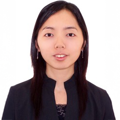 Portrait of Ir Sally LEUNG, smiling, wearing black blazer and earrings