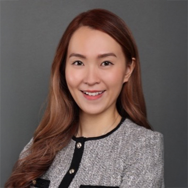 Ms. Mandy Wong, smiling professional portrait in gray tweed jacket with black trim.