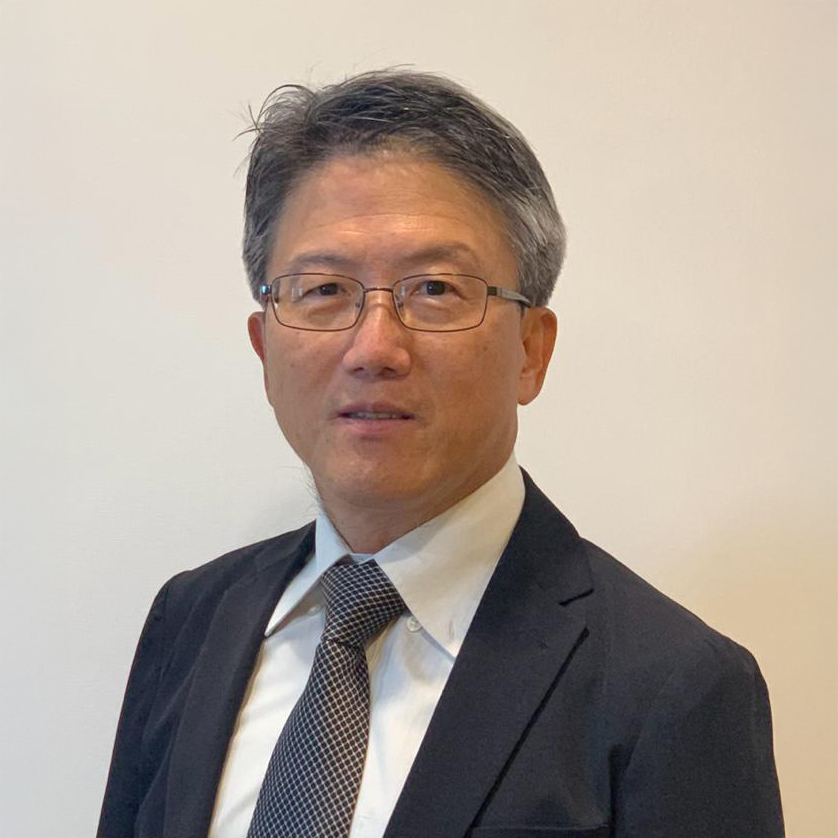 Man with glasses wearing suit and tie