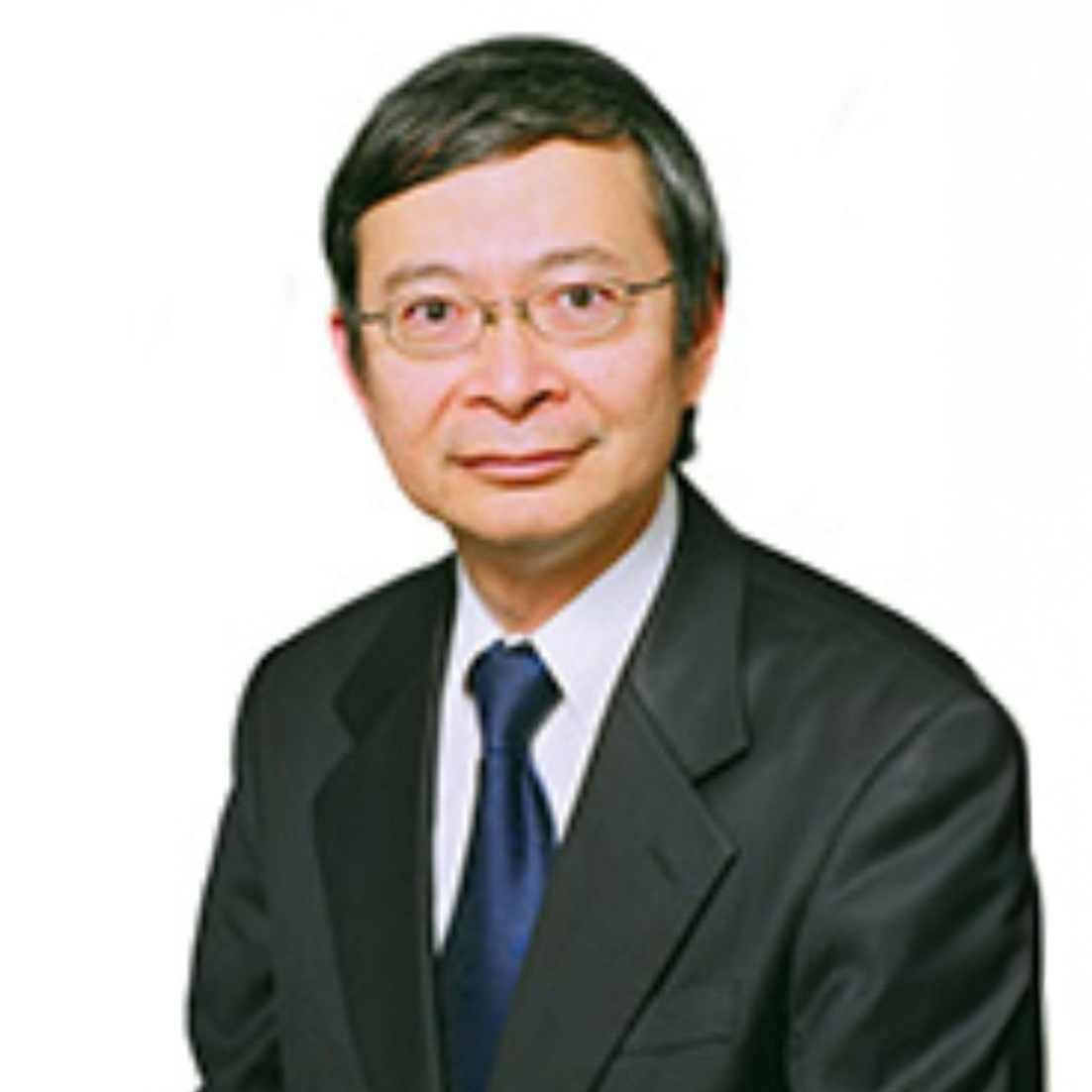 Portrait of a man in a suit and glasses