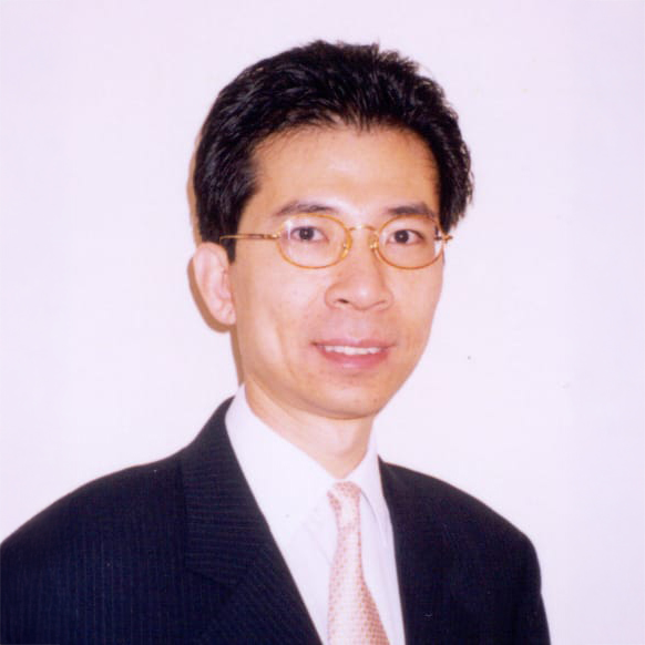 Portrait of a man with glasses wearing a suit and tie.