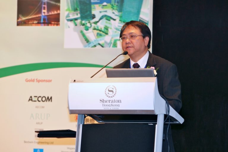 Man speaking at podium at Sheraton Hong Kong hotel event