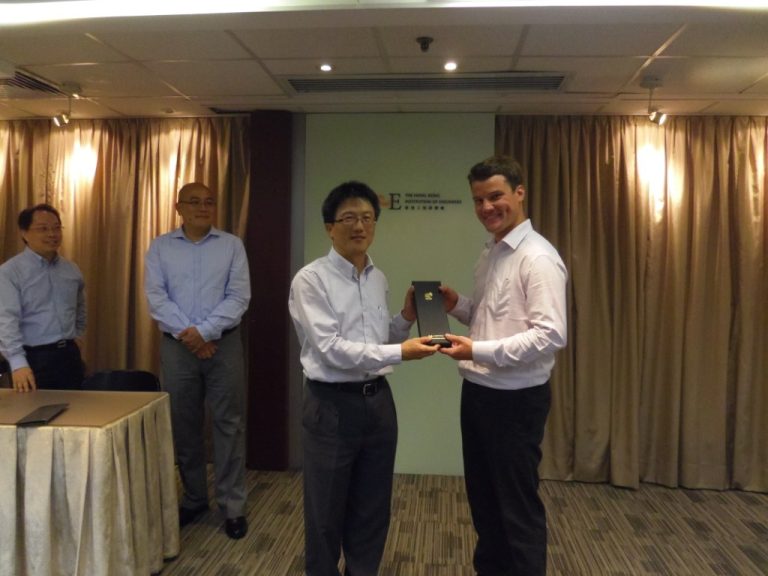 Man presenting award to another man at Hong Kong Institution of Engineers event
