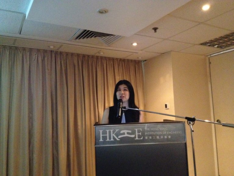Woman speaking at podium for The Hong Kong Institution of Engineers