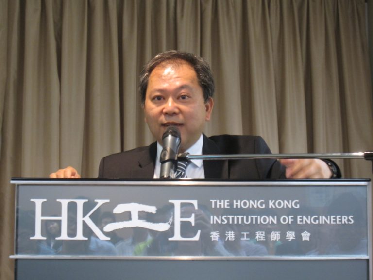 Man speaking at podium for The Hong Kong Institution of Engineers event