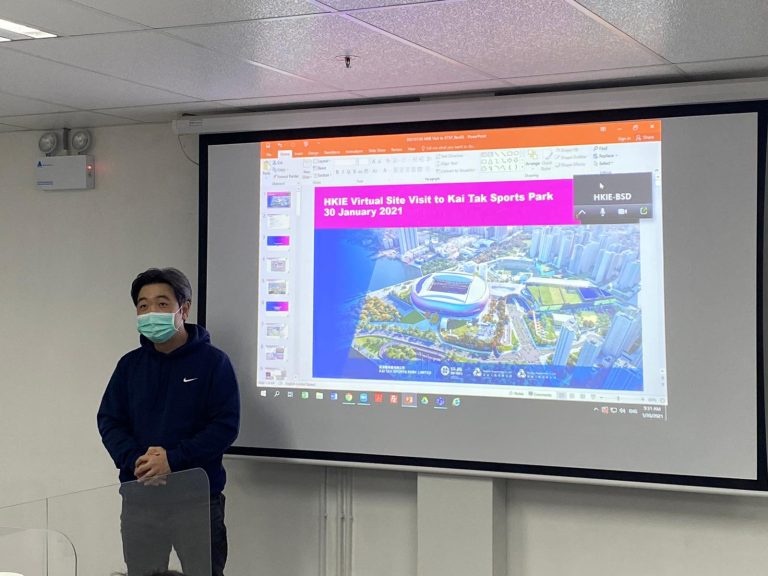 Man wearing mask presenting PowerPoint on Kai Tak Sports Park virtual visit.