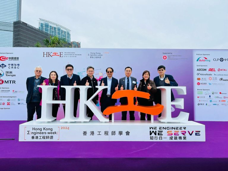 Group of people posing with thumbs up at Hong Kong Engineers Week 2024 event.
