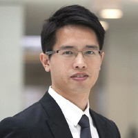 Portrait of Ir Edward Siu, wearing glasses and formal attire