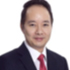 Man in suit and red tie, professional headshot