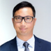 Man in suit and glasses, professional headshot