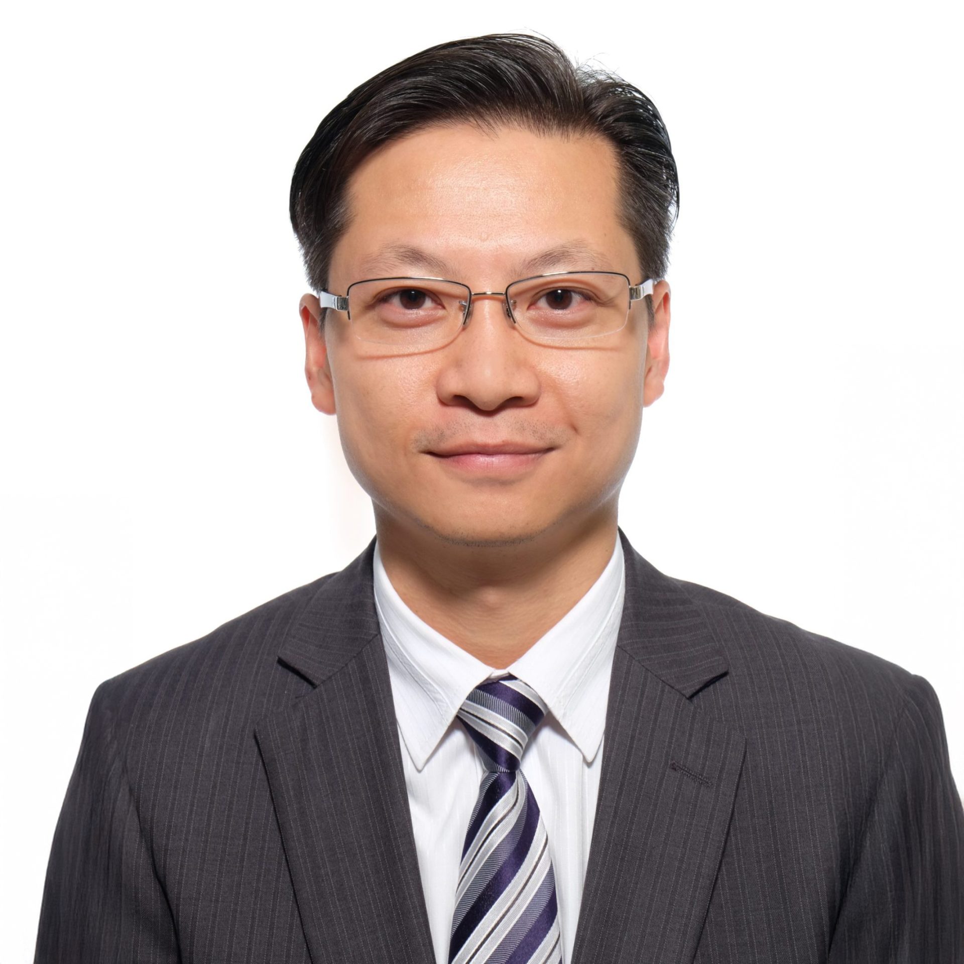 Man in suit and glasses, professional headshot