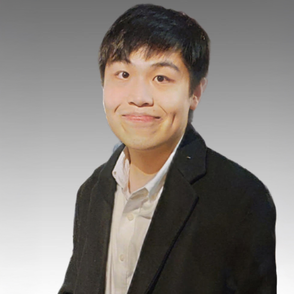 Portrait of Mr Ken K W Chan smiling, wearing a dark blazer and light shirt.