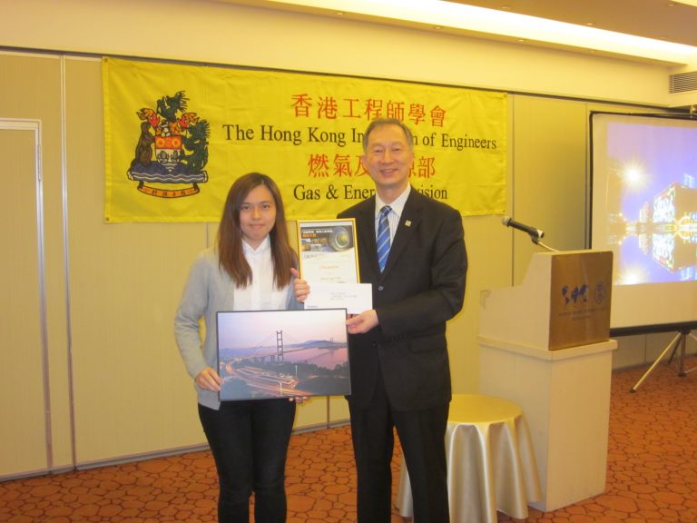 Man and woman posing with award and framed picture at Hong Kong Institution of Engineers event