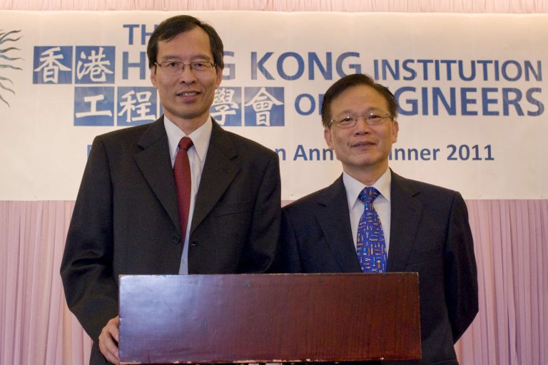 Two men in suits standing at a podium at the Hong Kong Institution of Engineers Annual Dinner 2011.