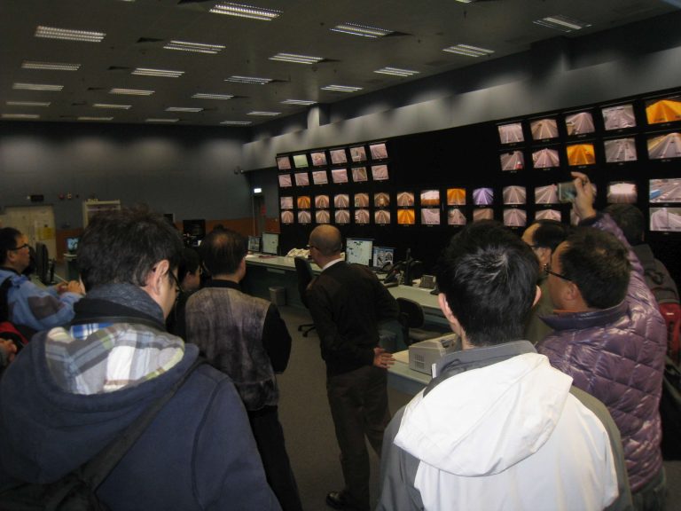 Group viewing traffic camera monitors in a control room