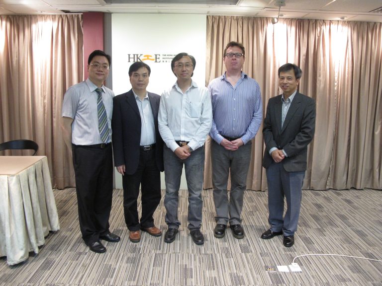 5 men posing for a photo in front of HKIE logo