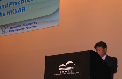 Man speaking at podium during engineering presentation at Hong Kong Convention and Exhibition Center