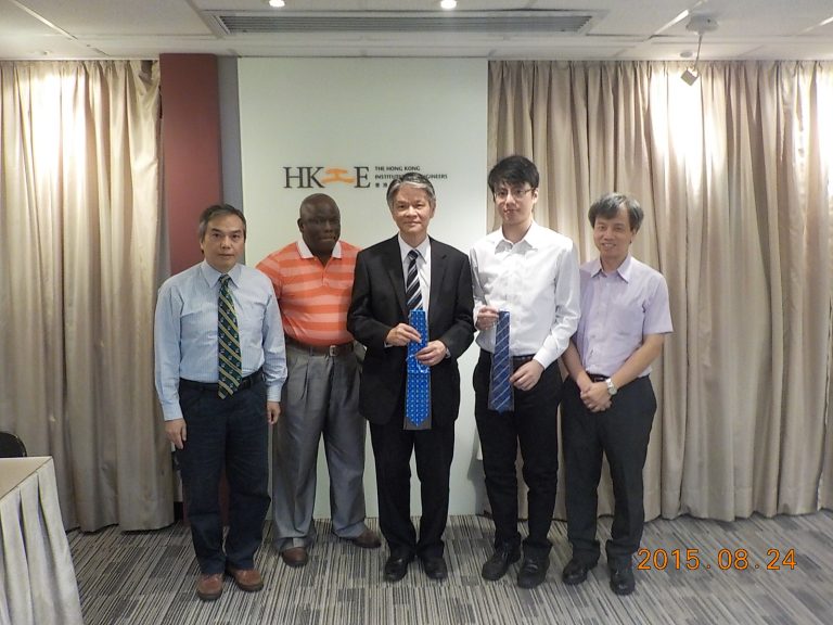 Five men posing for a photo in front of The Hong Kong Institution of Engineers logo.