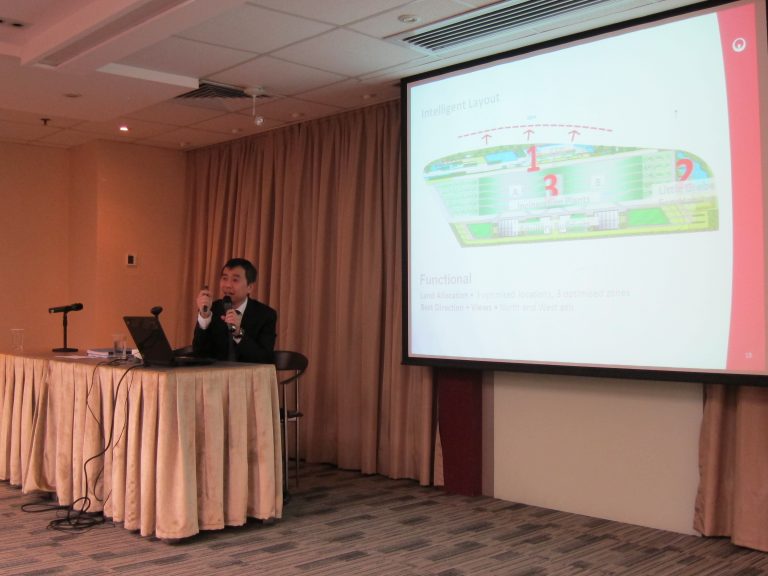 Man shows layout on screen at conference