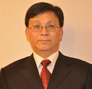 Man in suit and glasses with red tie