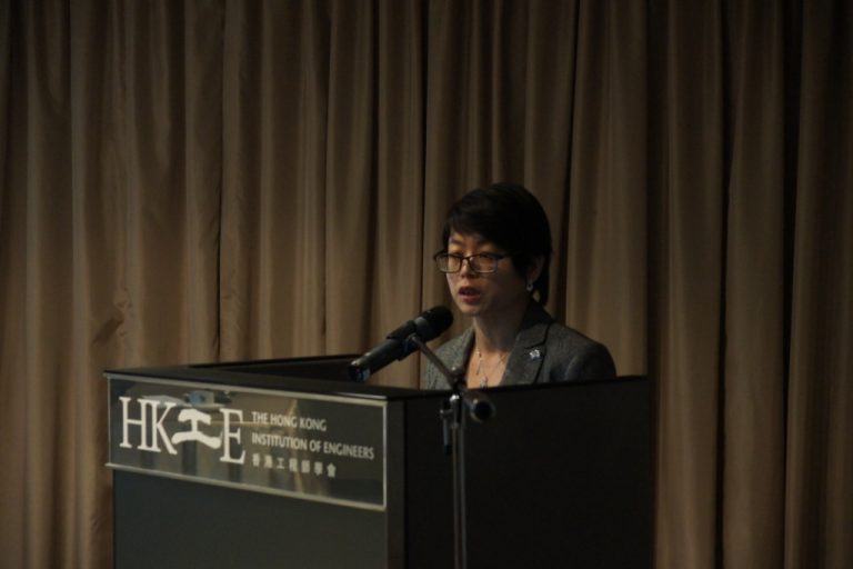 Woman speaking at podium for The Hong Kong Institution of Engineers
