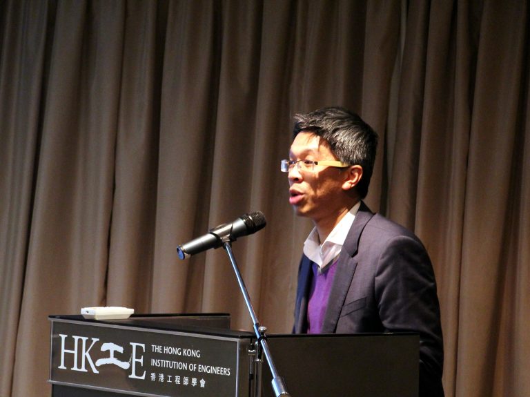 Man speaking at podium for The Hong Kong Institution of Engineers