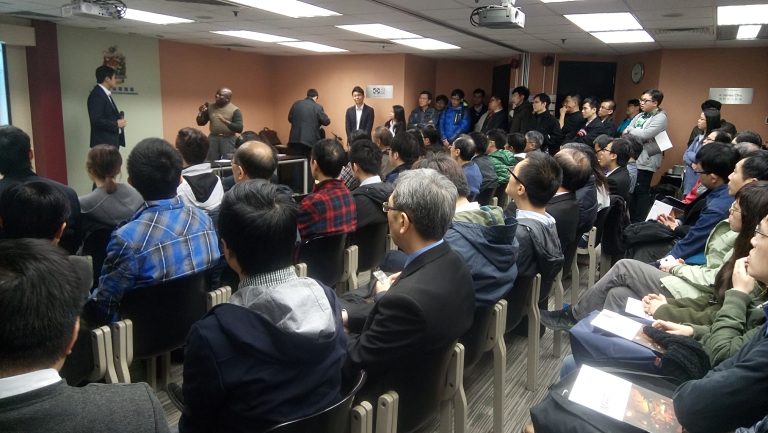 People listening to speakers