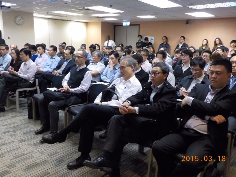 Audience attending a presentation in a conference room, March 18, 2015.