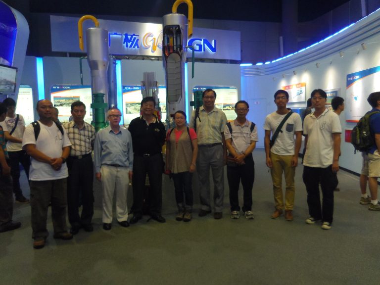 People posing with reactor models