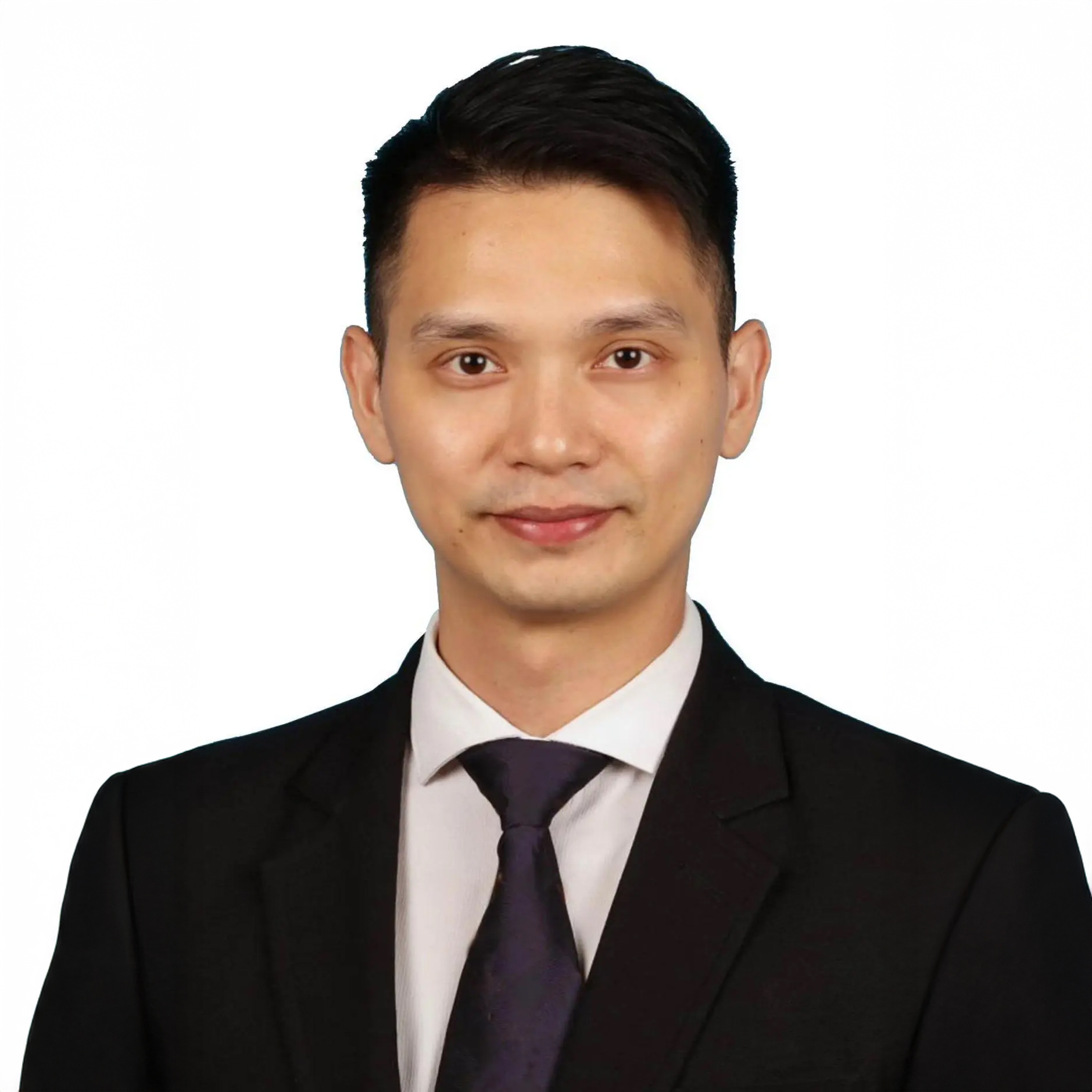 Professional headshot of a man in a black suit and purple tie.