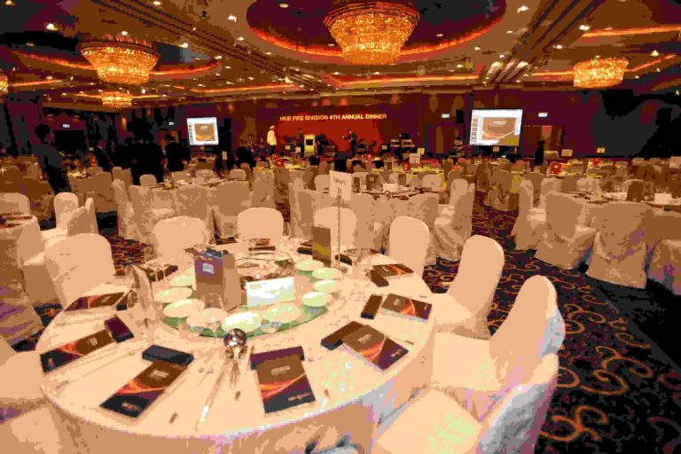 Grand banquet hall set for HK Fire Division 4th Annual Dinner with round tables and chandeliers.