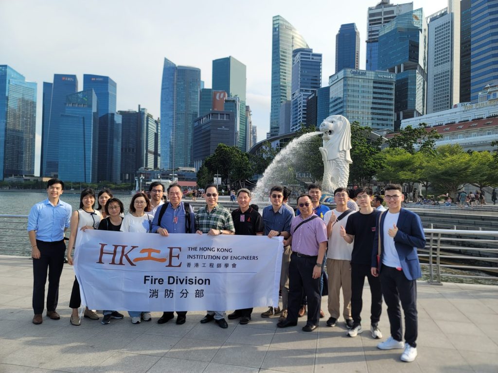 Engineers posing with Merlion