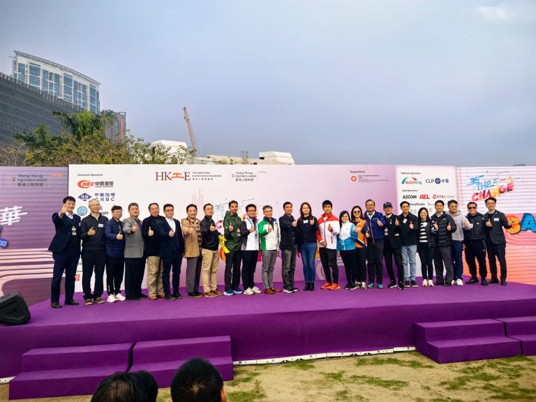 Group of people posing with thumbs up at Hong Kong Engineers Week event.