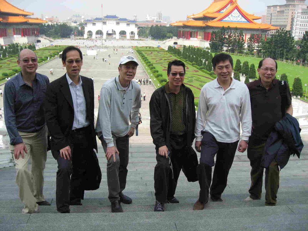 Men on steps in square