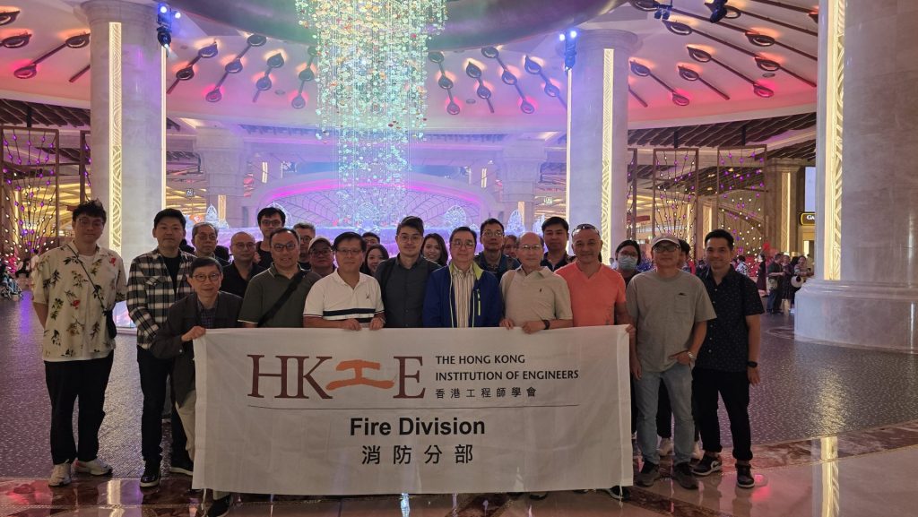 Engineers holding banner