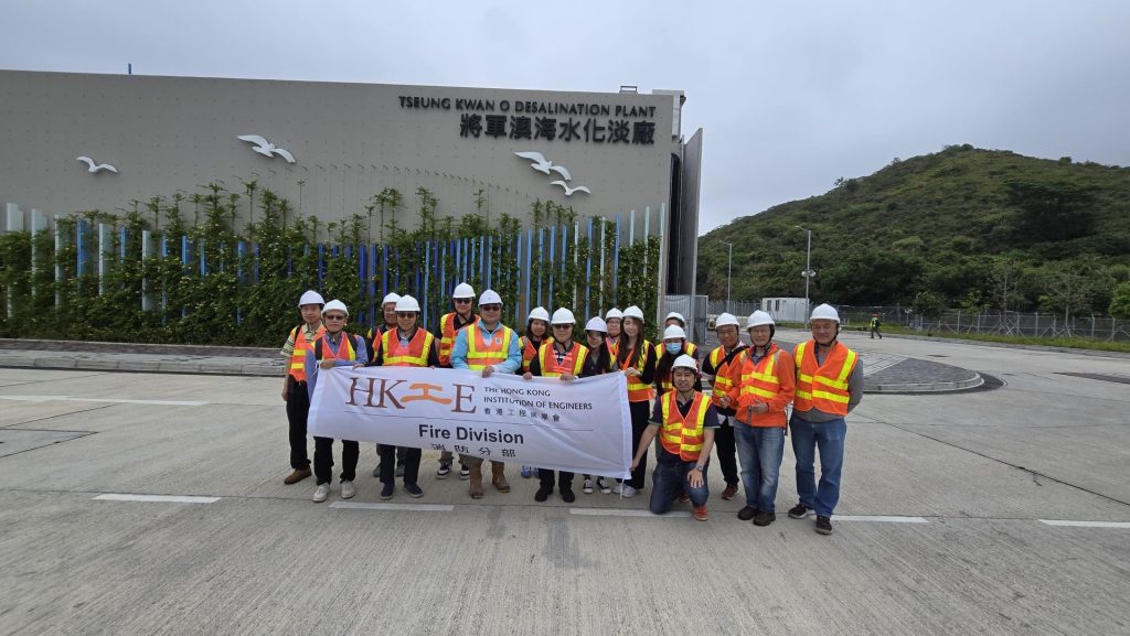 Engineers with banner at plant