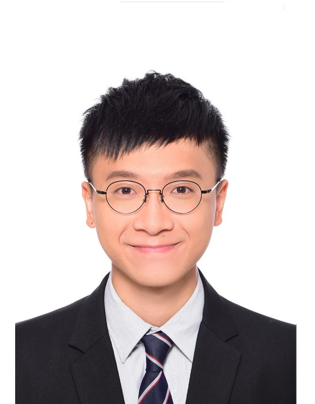 Portrait of a smiling man with glasses wearing a suit and tie.
