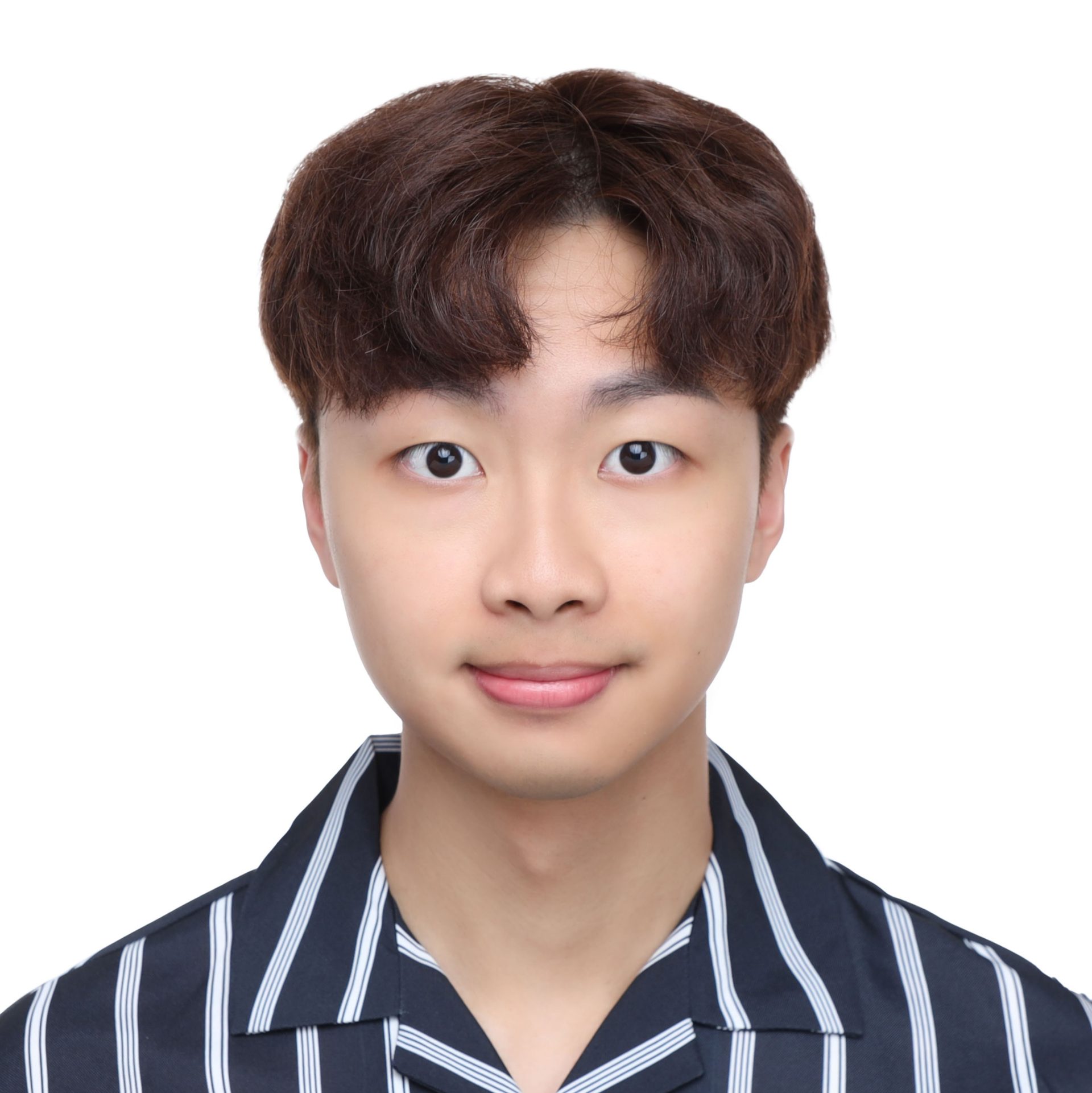 Headshot of a young man with brown hair wearing a striped shirt