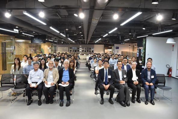Group of attendees seated in conference room during event