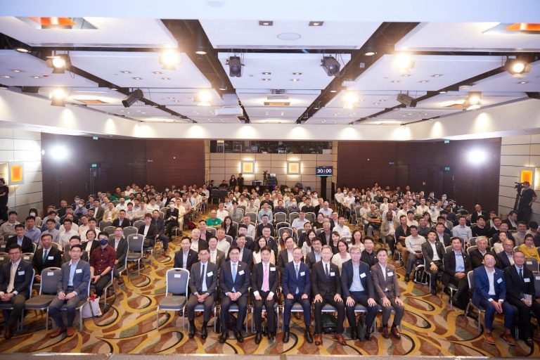 Group of attendees seated in conference hall during event
